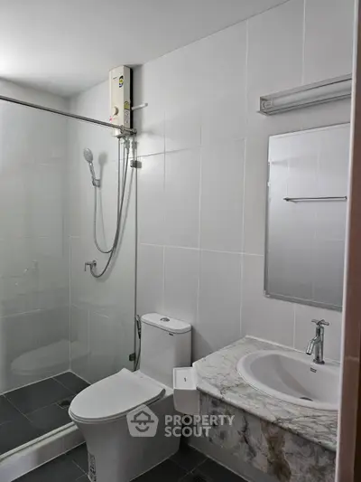 Modern bathroom with glass shower and sleek fixtures