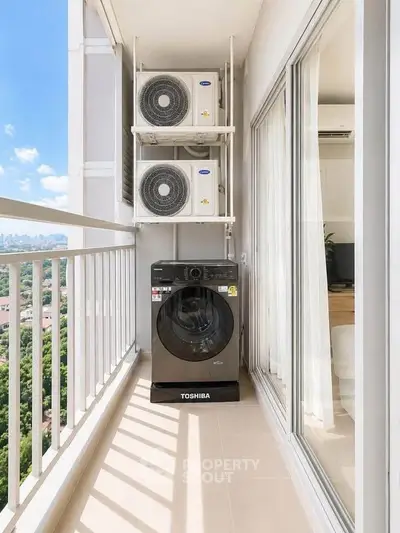 Modern balcony with washing machine and air conditioning units, offering a stunning city view.