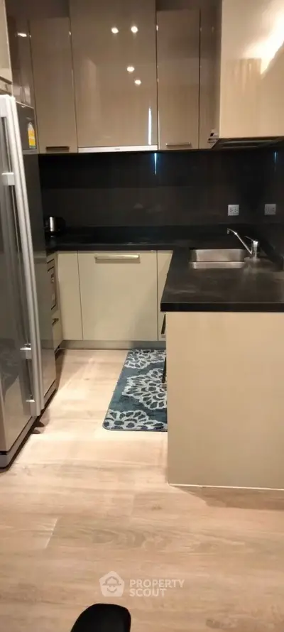 Modern kitchen with sleek cabinets and stainless steel appliances