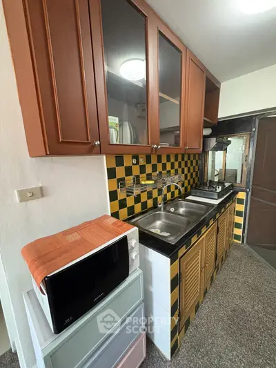 Charming kitchen with vintage tile backsplash and modern appliances