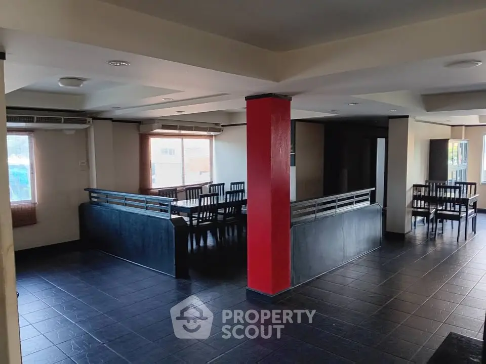 Spacious open-plan interior with modern design and ample natural light, perfect for versatile living or dining area.