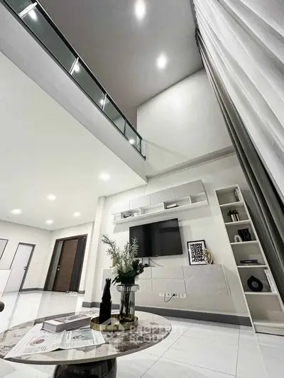 Luxurious modern living room with high ceilings and elegant decor