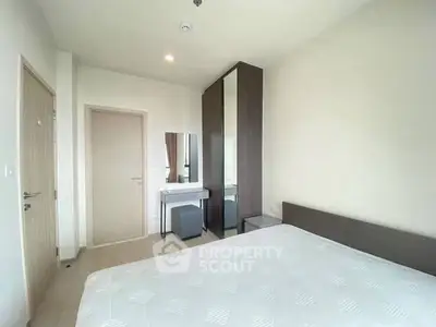 Modern bedroom with minimalist design and ample natural light