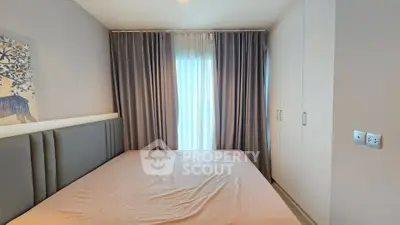 Cozy bedroom with elegant curtains and built-in wardrobe, perfect for a restful retreat.