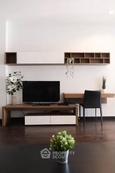 Modern living room with sleek TV unit and stylish shelving, perfect for contemporary living.