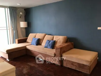 Spacious living room with stylish L-shaped sofa and elegant decor
