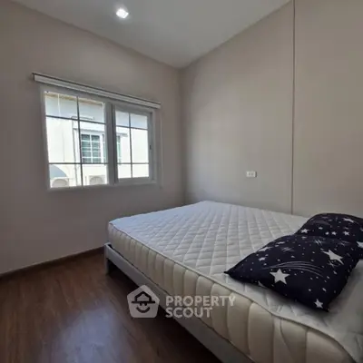 Cozy bedroom with natural light and minimalist design