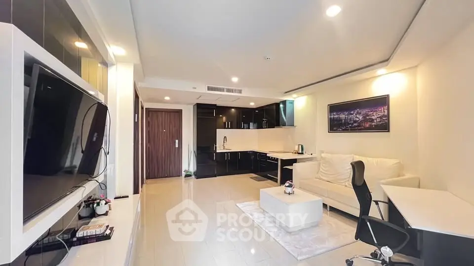 Modern living room with sleek kitchen and stylish decor