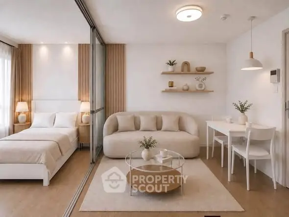 Modern studio apartment with cozy living area, stylish decor, and natural light.