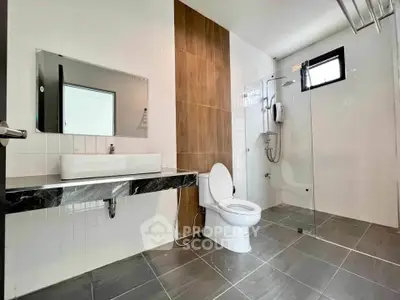 Modern bathroom with sleek design and glass shower enclosure