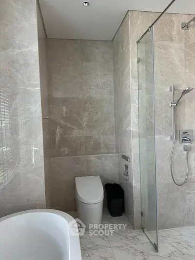 Luxurious modern bathroom with marble tiles and sleek fixtures