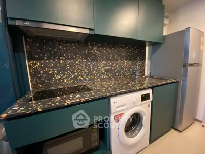 Modern kitchen with sleek appliances and terrazzo countertop