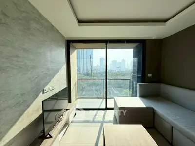 Modern living room with city view and sleek furniture