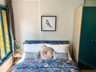 Charming bedroom with vibrant floral bedding and stylish decor