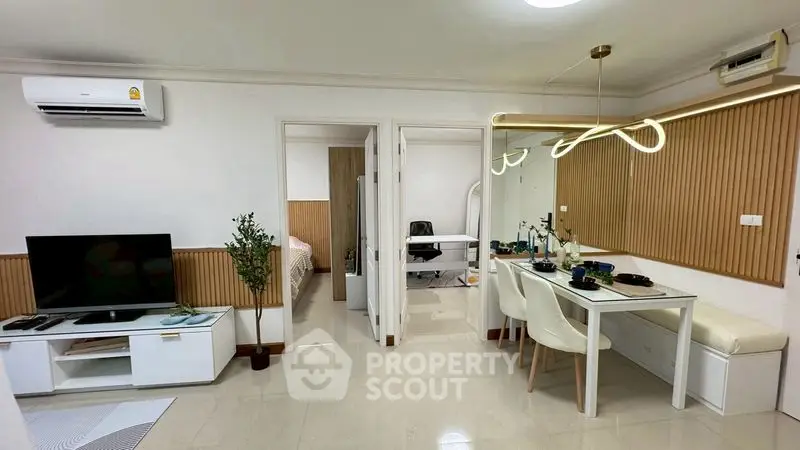 Modern apartment interior with stylish dining area and cozy living space