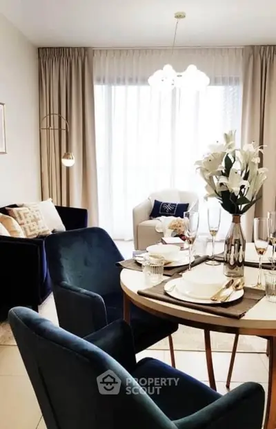 Elegant dining area with stylish chairs and a chic table setting in a modern living room.