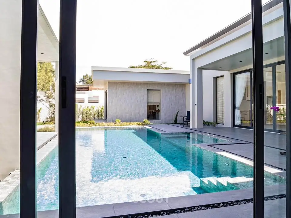 Luxurious modern villa with sparkling pool and sleek architecture