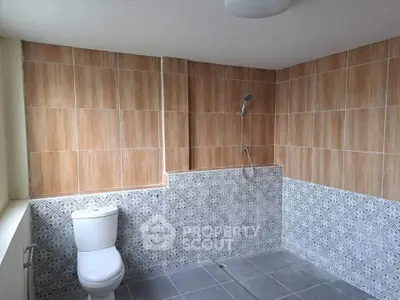Spacious bathroom with modern tile design and walk-in shower