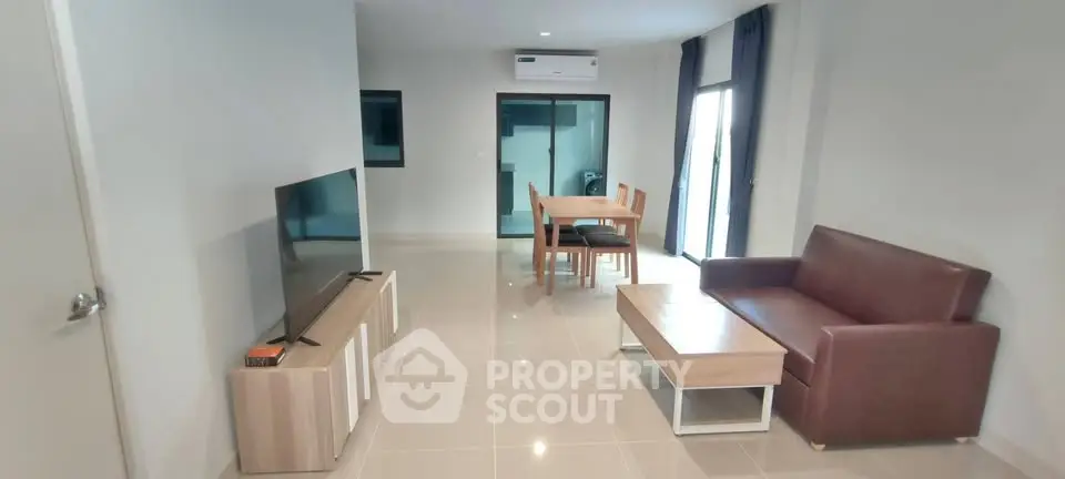 Spacious modern living room with sleek furniture and natural light