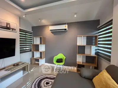 Modern living room with stylish decor and air conditioning