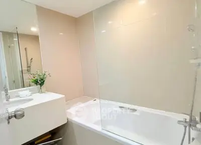 Modern bathroom with sleek bathtub and elegant fixtures