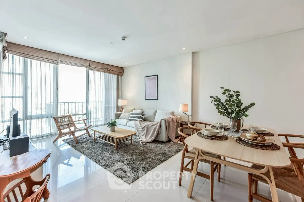 Spacious modern living room with elegant dining area and natural light