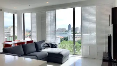 Spacious living room with panoramic city view and modern furniture