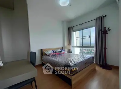 Modern bedroom with large window and stylish decor