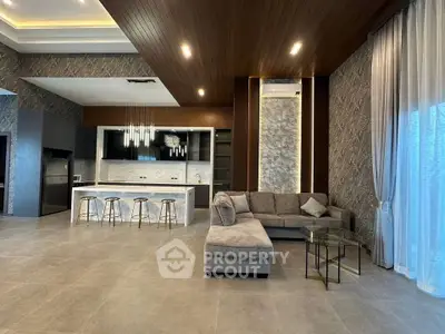 Luxurious modern living room with open kitchen and elegant decor
