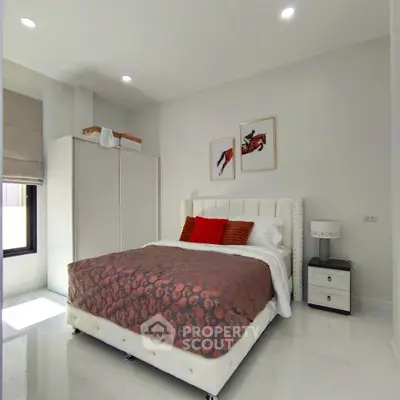 Modern bedroom with stylish decor and natural light