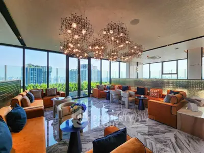 Luxurious living room with panoramic city views and elegant chandeliers.