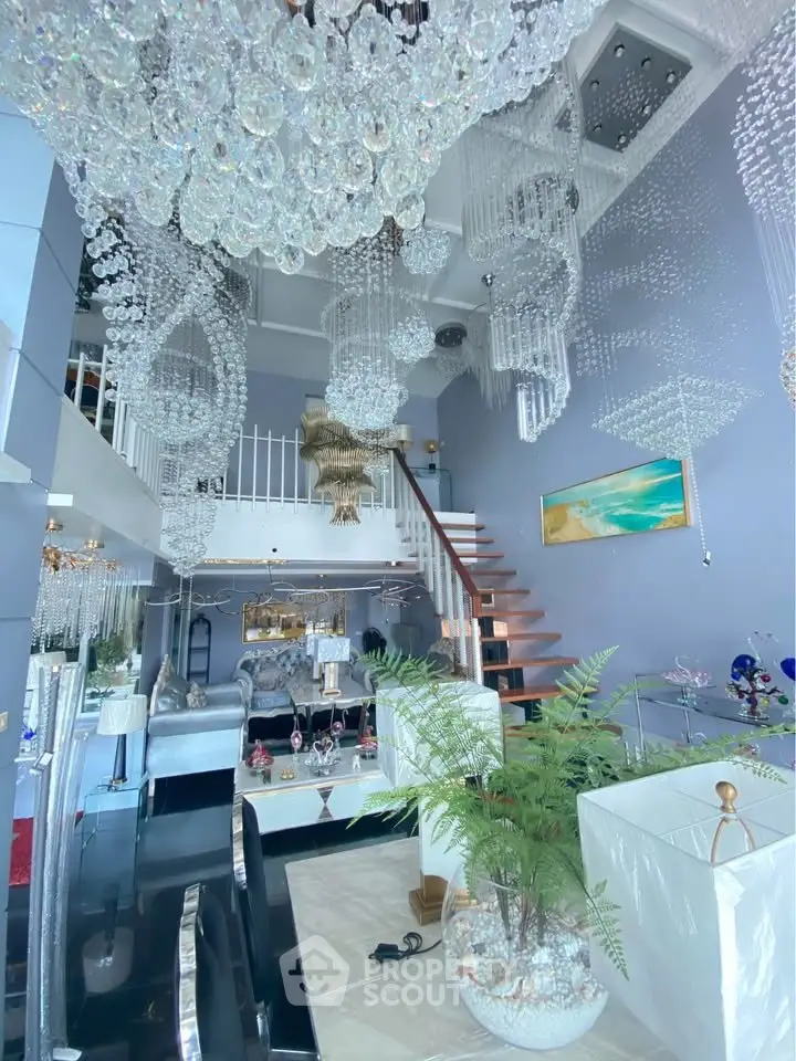 Luxurious living room with stunning chandeliers and modern decor