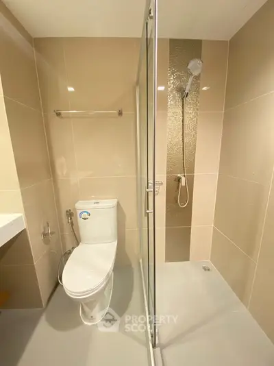Modern bathroom with glass shower enclosure and sleek design