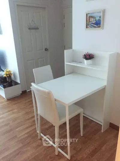 Cozy study nook with white desk and chair in modern apartment
