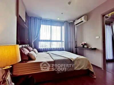 Modern bedroom with large window and air conditioning unit, featuring elegant decor and cozy ambiance.