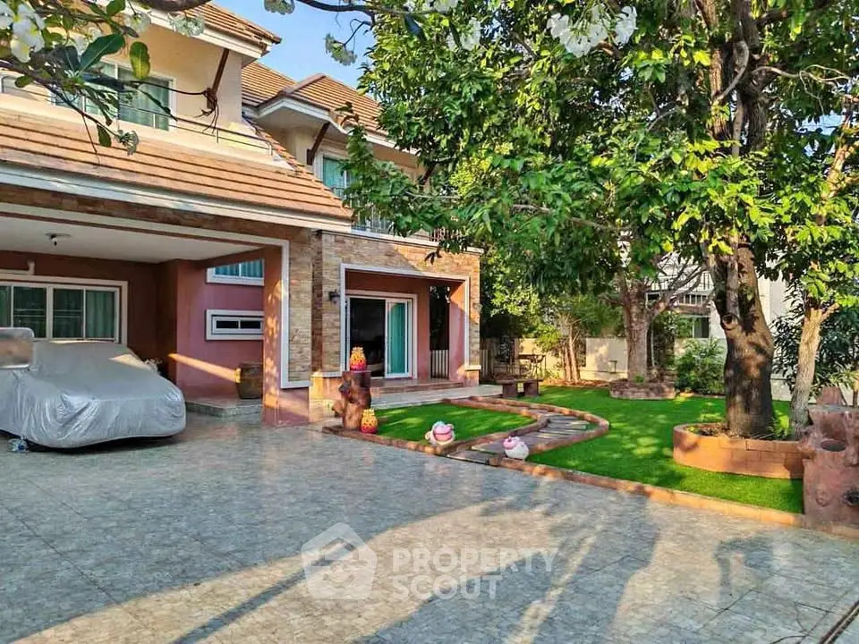 Charming suburban home with spacious driveway and lush garden, perfect for family living.