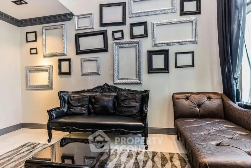 Luxurious living room with elegant black leather sofa and stylish frame decor