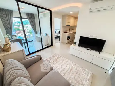 Modern living room with balcony view and sleek interior design