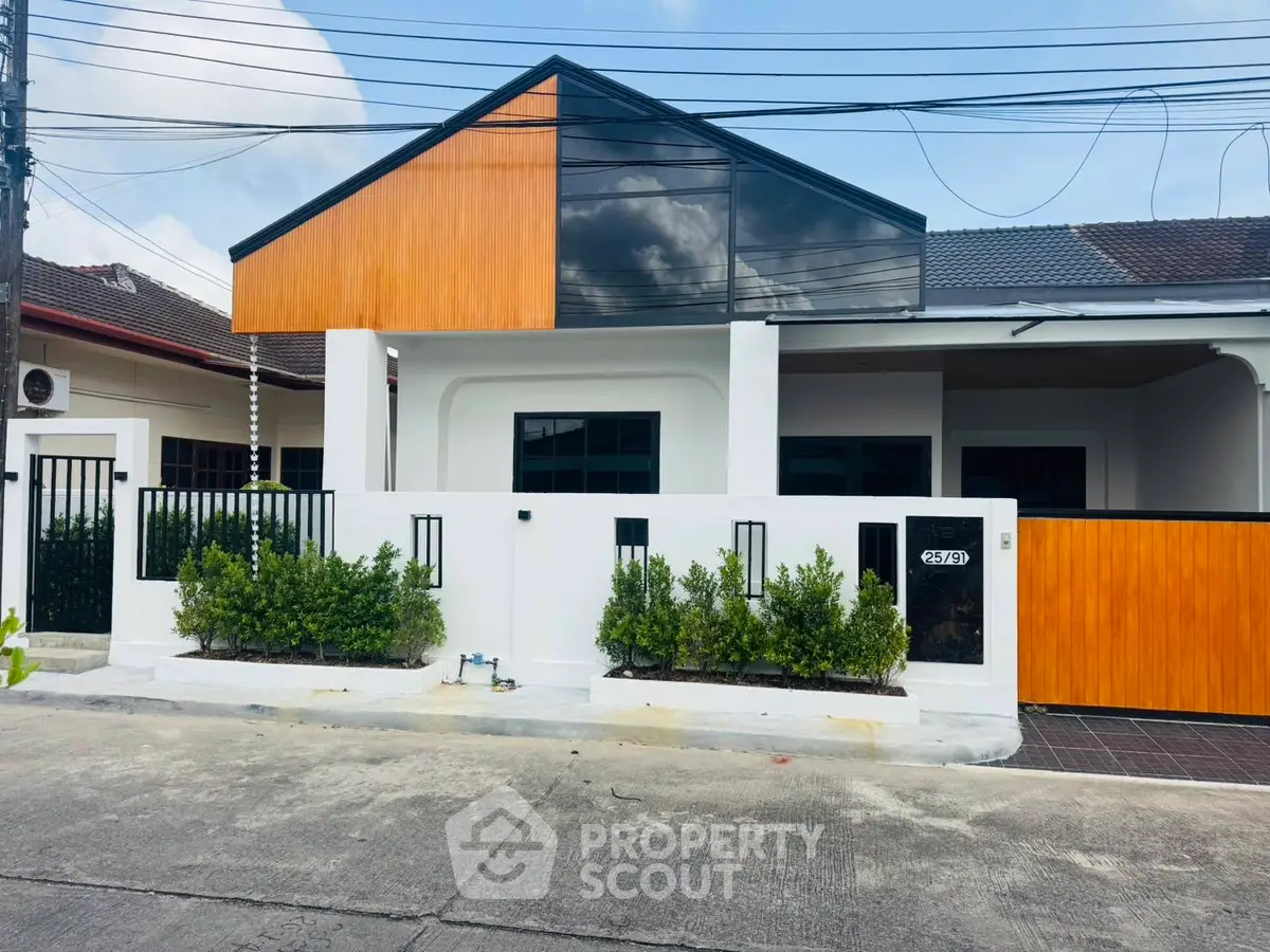 Modern single-story house with sleek design and wooden accents