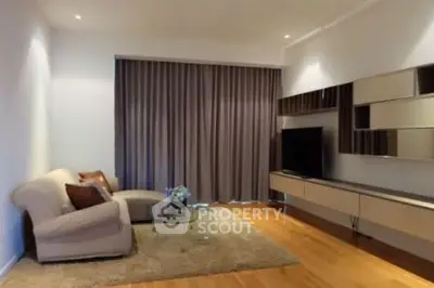 Spacious modern living room with elegant decor and wooden flooring