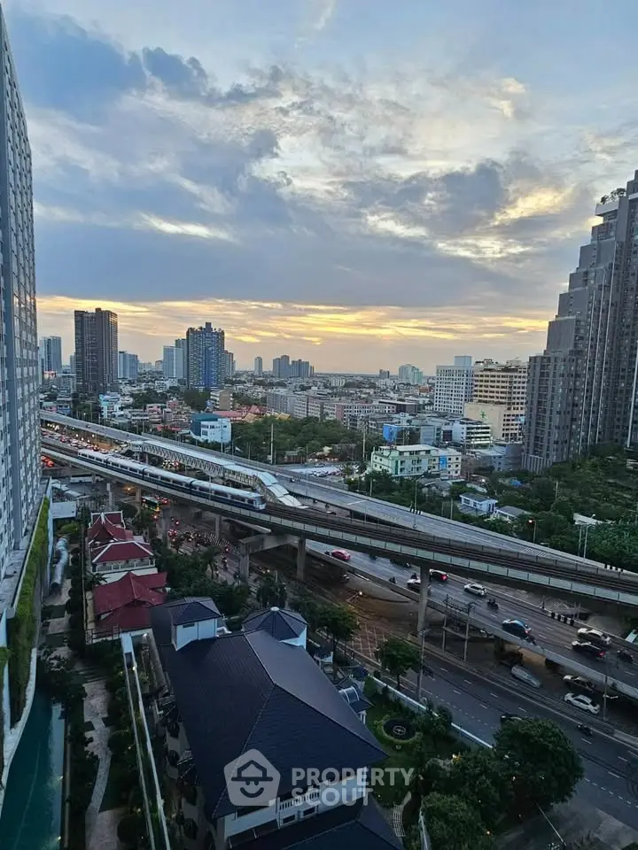 Stunning cityscape view from high-rise building at sunset, showcasing urban skyline and vibrant city life.