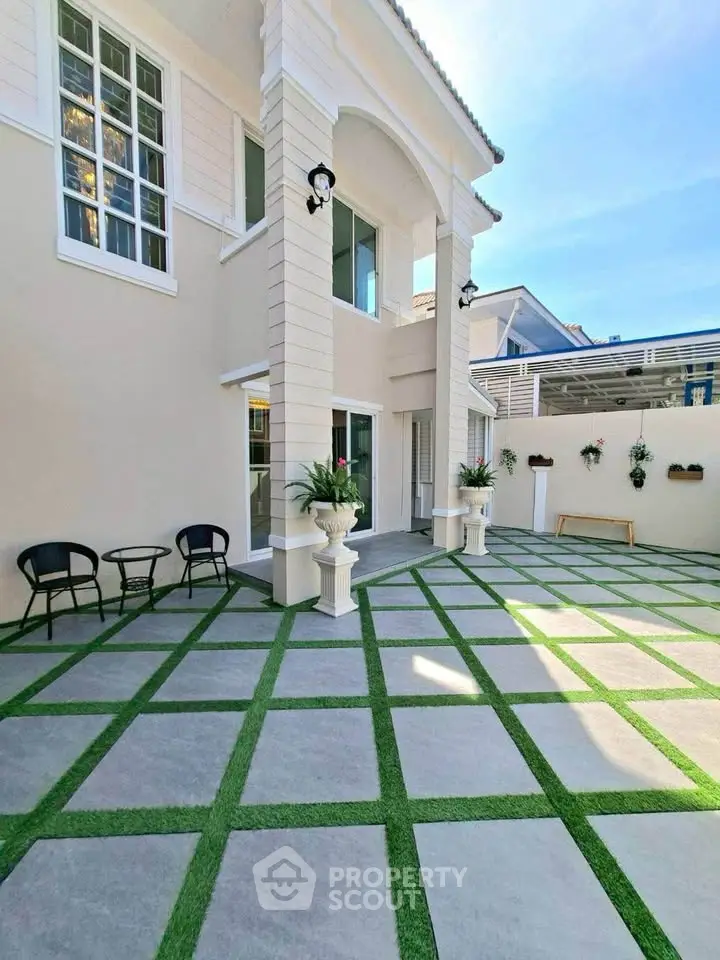 Stunning modern home exterior with spacious patio and elegant design