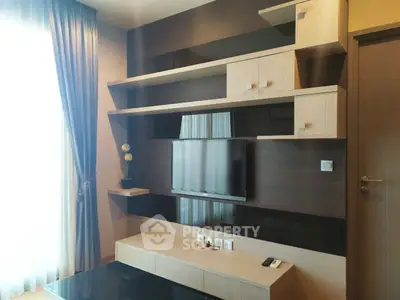 Modern living room with sleek TV unit and elegant shelving