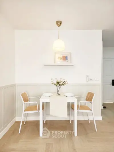 Charming dining nook with elegant decor and soft lighting, perfect for cozy meals.