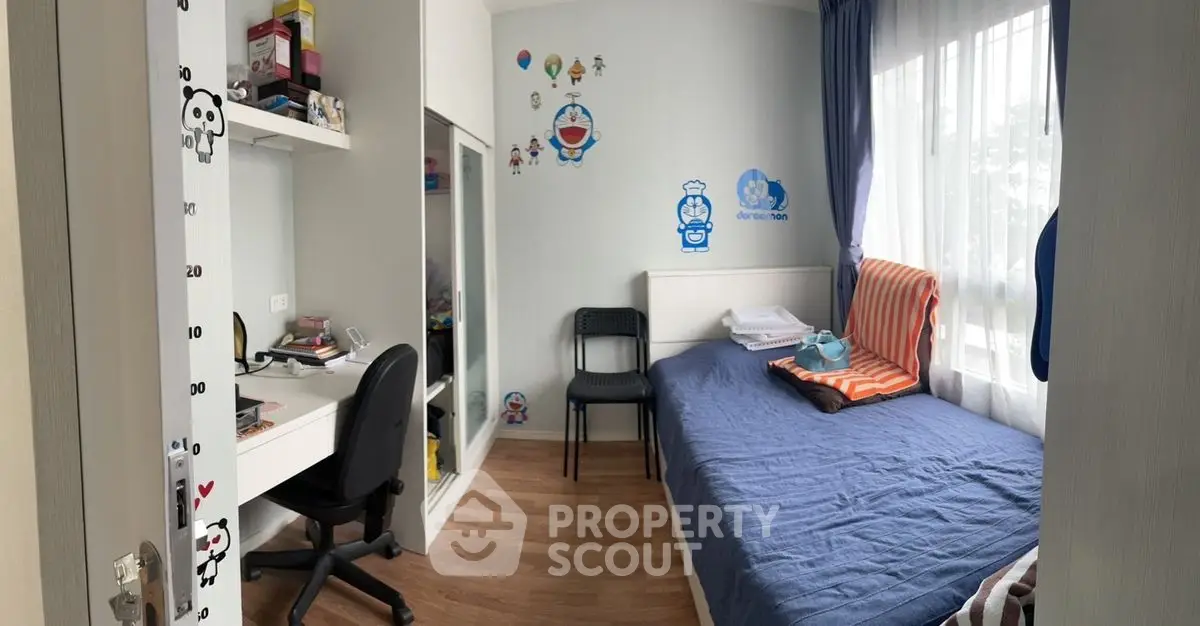 Charming children's bedroom with playful decor and cozy study area.