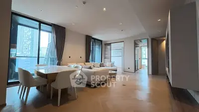 Spacious modern living room with elegant dining area and large windows