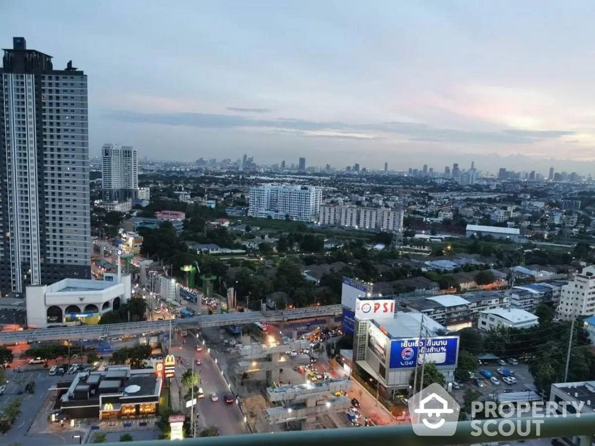 Stunning cityscape view from high-rise apartment balcony at dusk