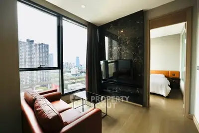 Modern living room with city view and adjacent bedroom
