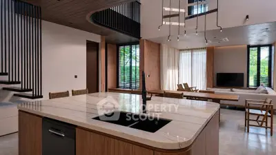 Luxurious open-plan living room with modern kitchen island and stylish decor