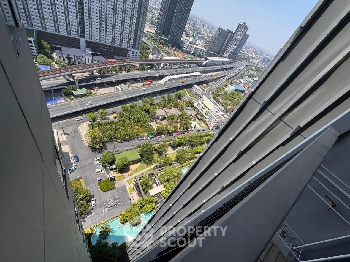 Stunning high-rise building view with urban landscape and highway, showcasing modern architecture and city living.